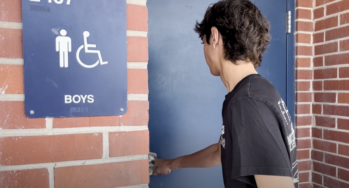 Junior Blake Johnson tries to enter the boys bathroom in building two on April 24, only to find it is locked.